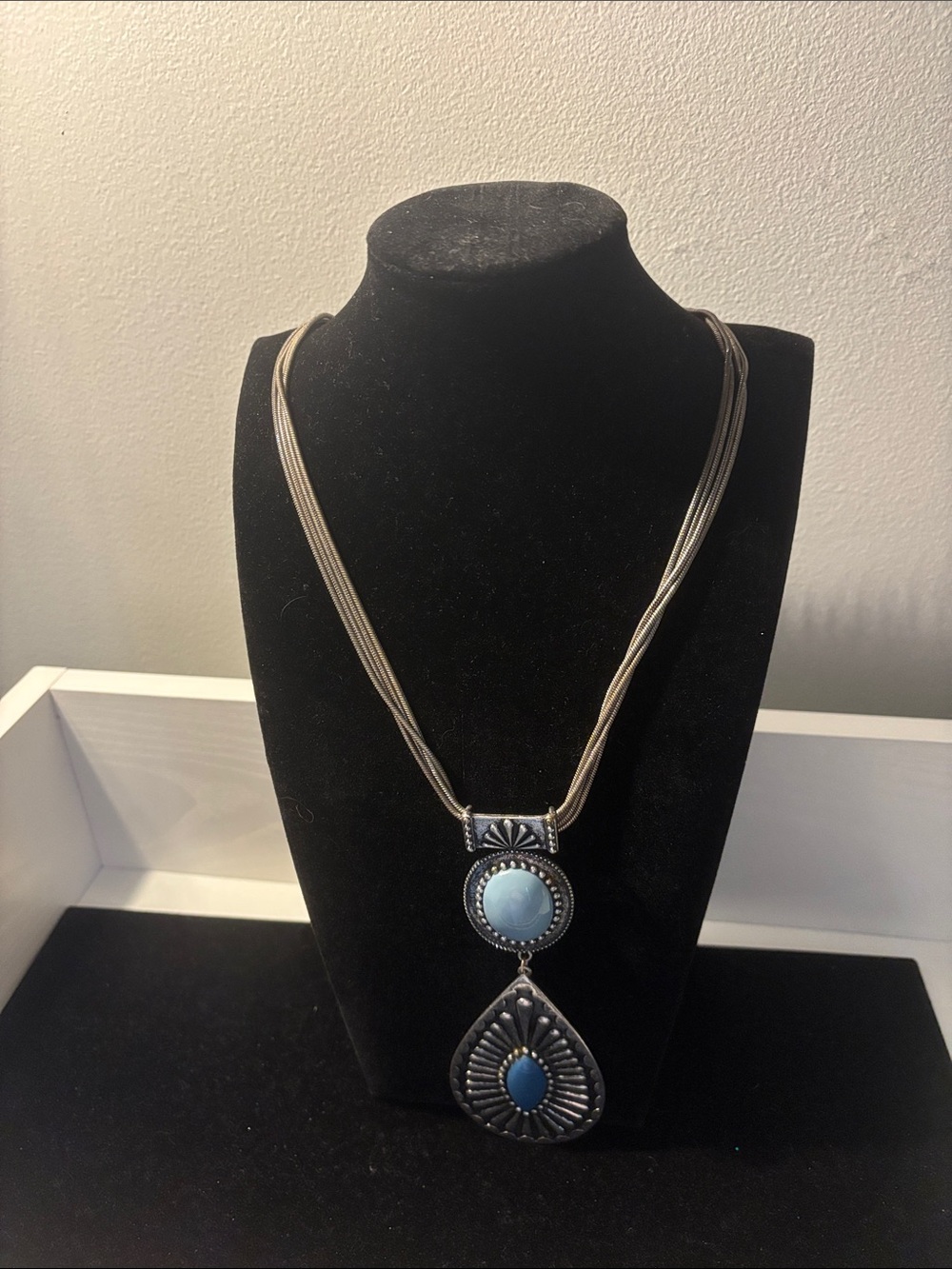 Silver-Tone Blue Stone Pendant Necklace
And matching earrings